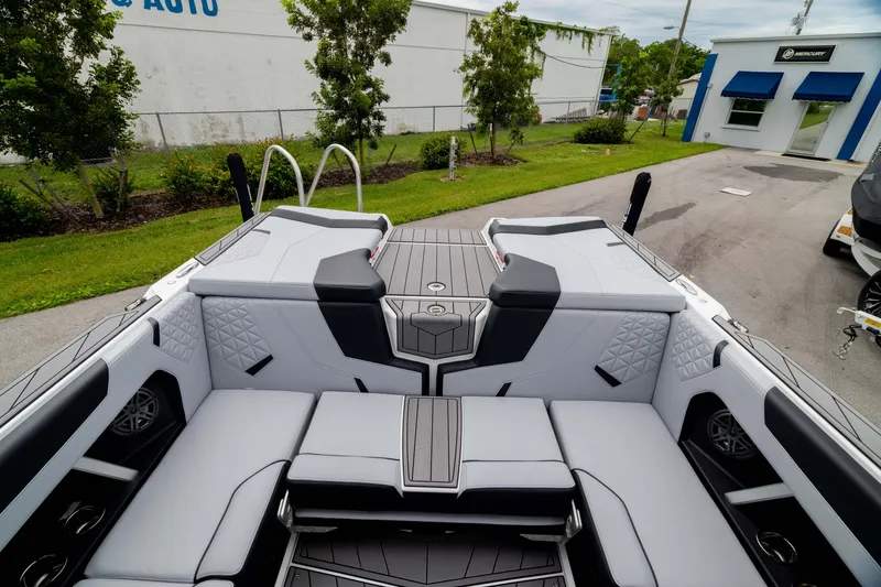 Slide: The Image of 2026 Nautique Super Air Nautique GS22 interior with sleek seating and modern design. - 12