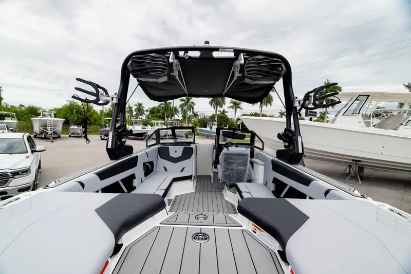 Slide: The Image of 2026 Nautique Super Air Nautique GS22 boat interior with sleek seating and advanced features. - 15