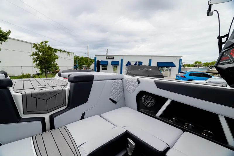Slide: The Image of 2026 Nautique Super Air Nautique GS22 interior with sleek seating and modern design elements. - 17