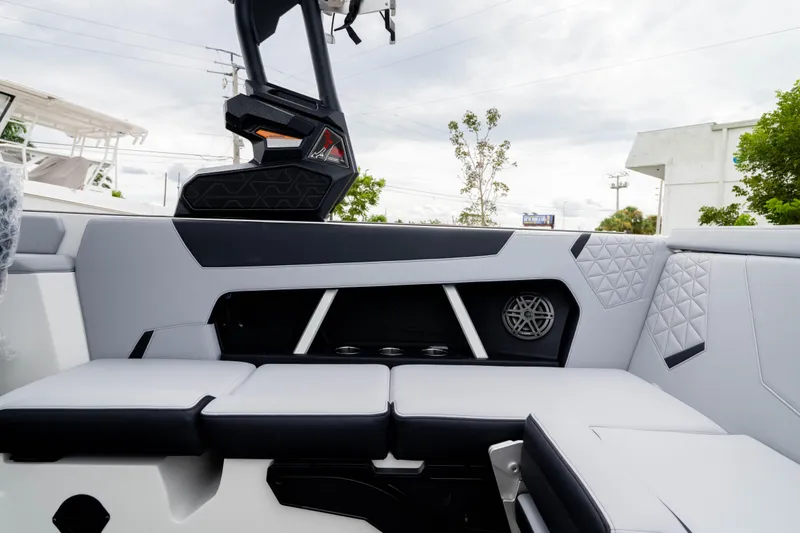 Slide: The Image of 2026 Nautique Super Air Nautique GS22 interior with sleek seating and modern design elements. - 23
