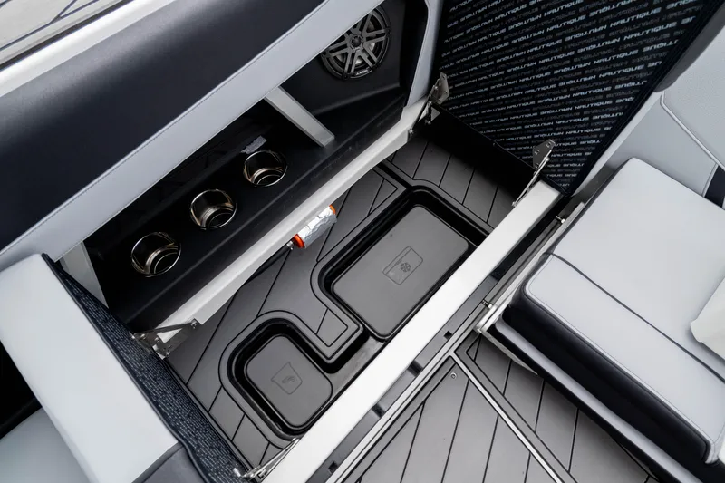 Slide: The Image of 2026 Nautique Super Air Nautique GS22 interior storage and seating detail. - 27
