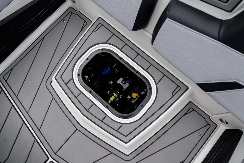 Slide: The Image of 2026 Nautique Super Air Nautique GS22 boat interior with open storage compartment. - 29