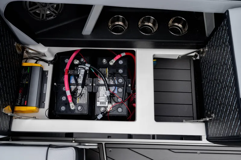 Slide: The Image of 2026 Nautique Super Air Nautique GS22 battery compartment with ProSport charger and wiring. - 33