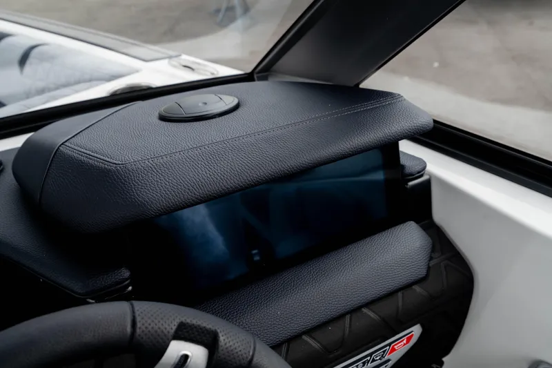 Slide: The Image of 2026 Nautique Super Air Nautique GS22 dashboard with sleek black leather detailing. - 36