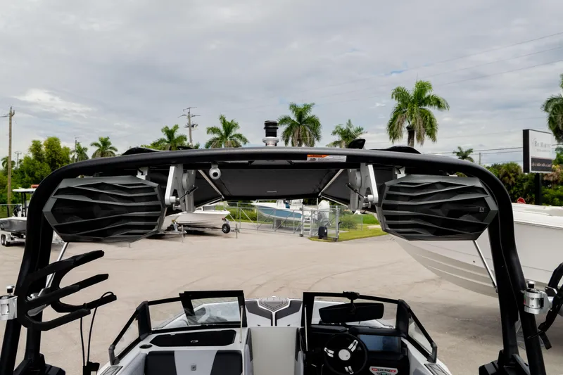 Slide: The Image of 2026 Nautique Super Air Nautique GS22 boat with advanced speaker system and sleek design. - 40