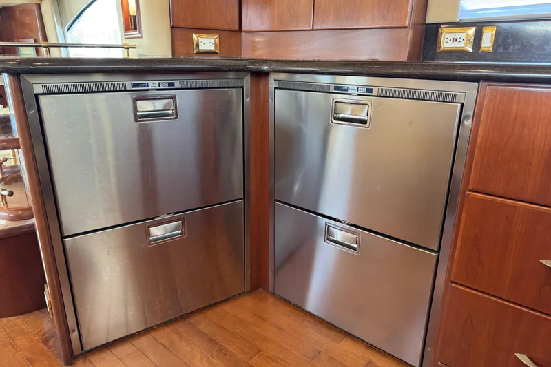 Slide: The Image of Stainless steel kitchen drawers in a wooden cabinet, Ovation 52, 2009 model. - 14