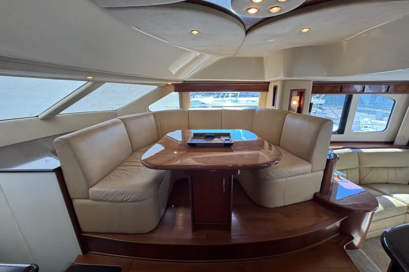 Slide: The Image of Luxurious interior of a 2009 Ovation 52 yacht with elegant seating and wooden table. - 15
