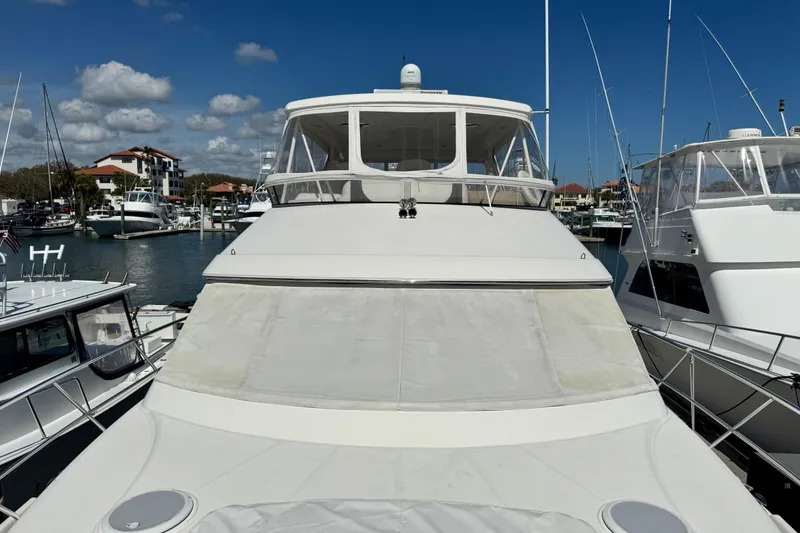 Slide: The Image of 2009 Ovation 52 yacht docked at marina under clear blue sky. - 20