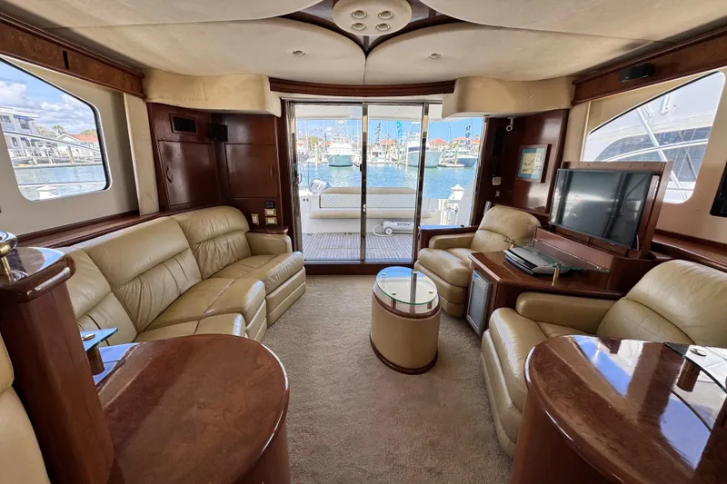 Slide: The Image of Luxurious 2009 Ovation 52 yacht interior with leather seating and elegant wood finishes. - 23