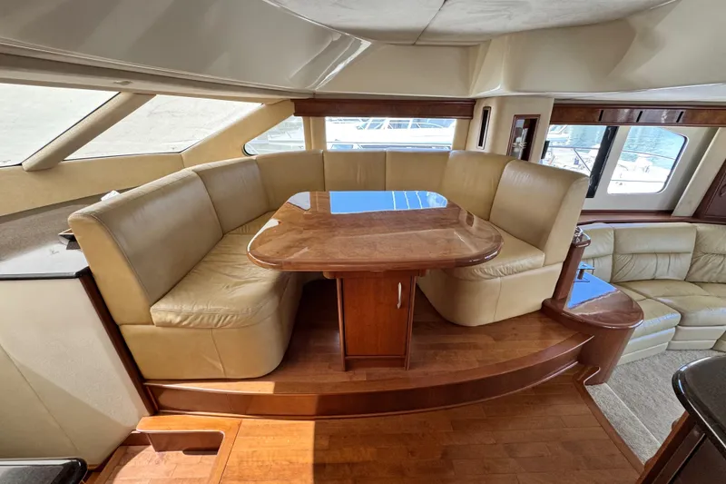 Slide: The Image of Luxurious 2009 Ovation 52 yacht interior with leather seating and wooden table. - 27