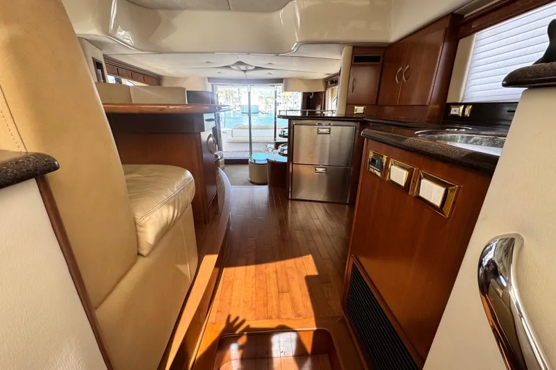 Slide: The Image of Luxurious interior of 2009 Ovation 52 yacht with modern kitchen and seating area. - 30