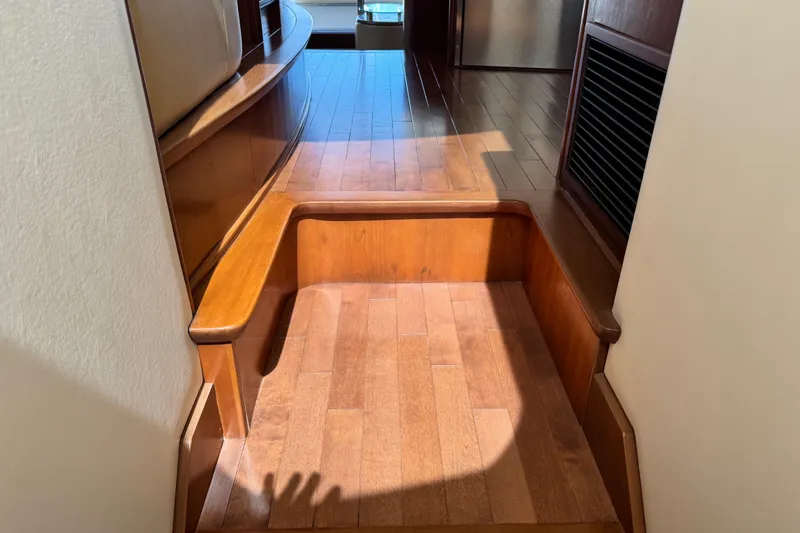 Slide: The Image of Wooden interior steps on a 2009 Ovation 52 yacht, showcasing polished finish. - 31