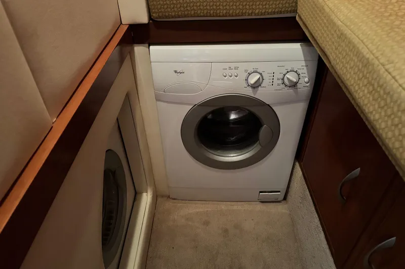 Slide: The Image of Compact laundry area with a Whirlpool washing machine in an Ovation 52 yacht, 2009 model. - 35