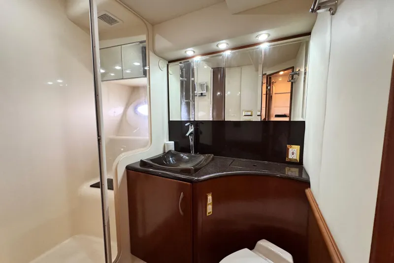 Slide: The Image of Luxurious bathroom in 2009 Ovation 52 yacht with modern fixtures and elegant design. - 38