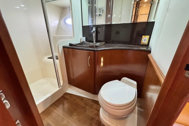 Slide: The Image of Luxurious 2009 Ovation 52 yacht bathroom with shower, sink, and toilet. - 39