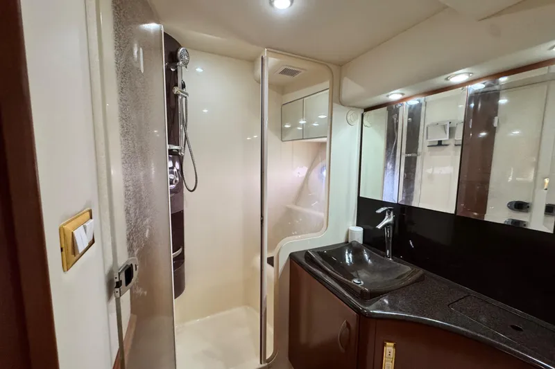 Slide: The Image of Luxurious bathroom in 2009 Ovation 52 yacht with modern shower and sleek sink design. - 40