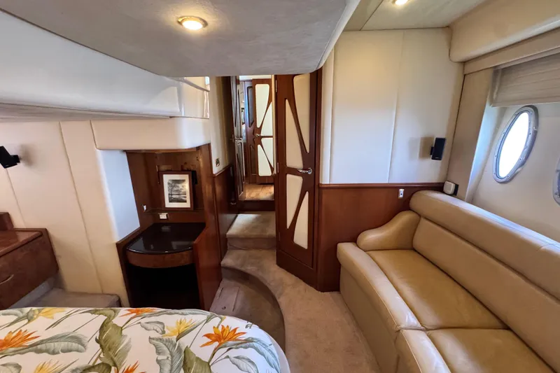 Slide: The Image of Luxurious 2009 Ovation 52 yacht interior with beige leather sofa and elegant wood accents. - 41
