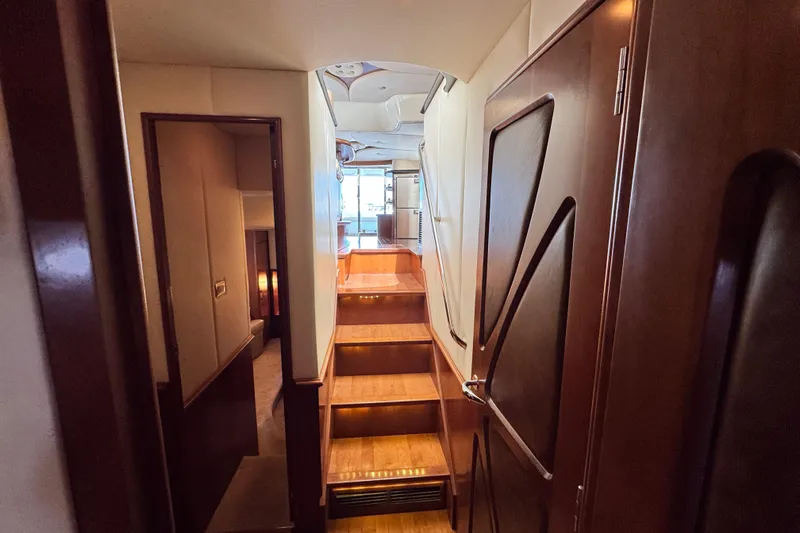 Slide: The Image of Interior of a 2009 Ovation 52 yacht with wooden staircase. - 47