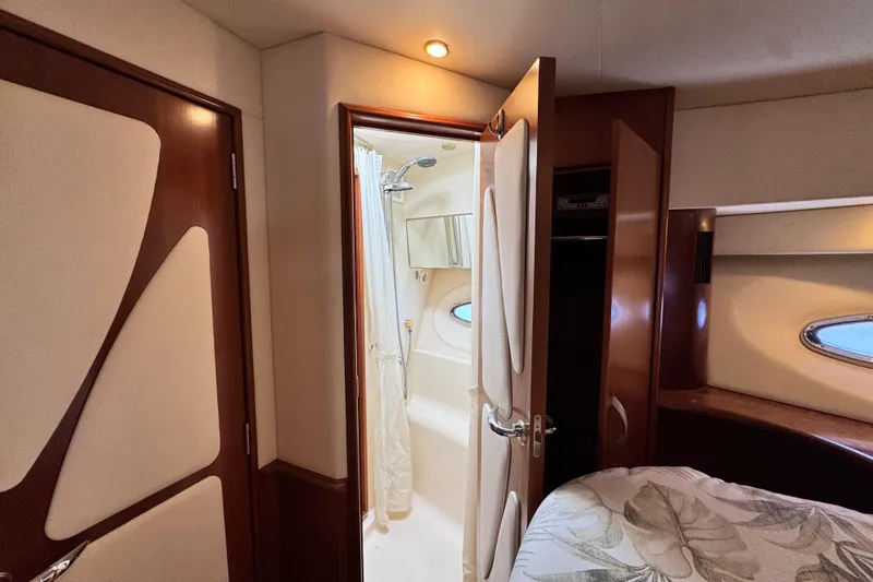 Slide: The Image of Luxurious interior of 2009 Ovation 52 yacht featuring a cozy bedroom and bathroom. - 50