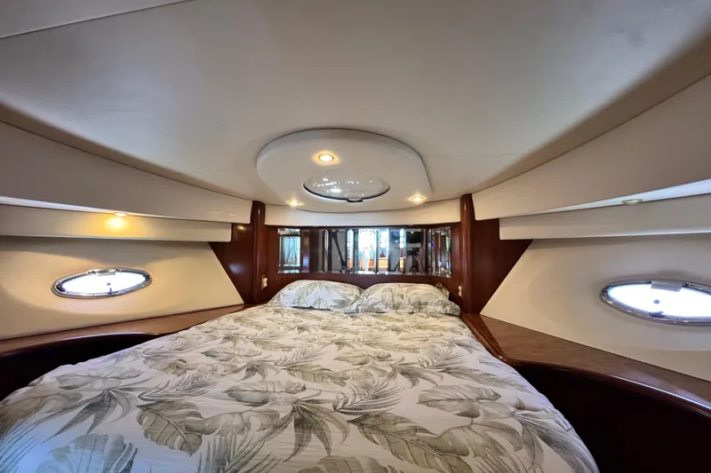 Slide: The Image of Luxurious cabin interior of 2009 Ovation 52 yacht with elegant bedding and ambient lighting. - 53
