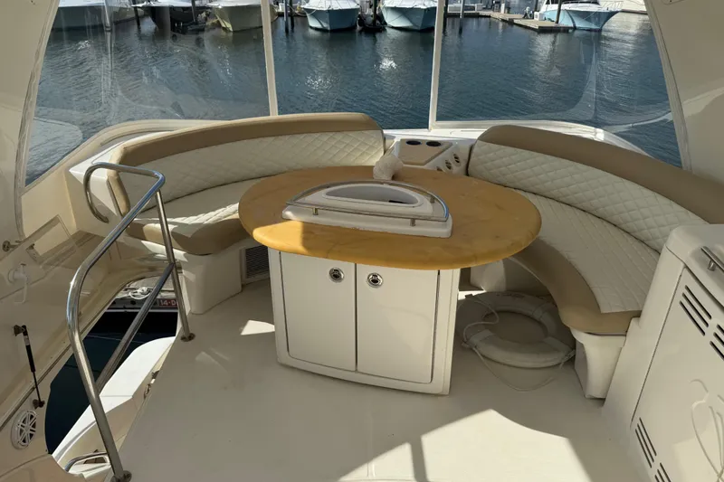 Slide: The Image of Luxurious 2009 Ovation 52 yacht interior with curved seating and round table. - 8