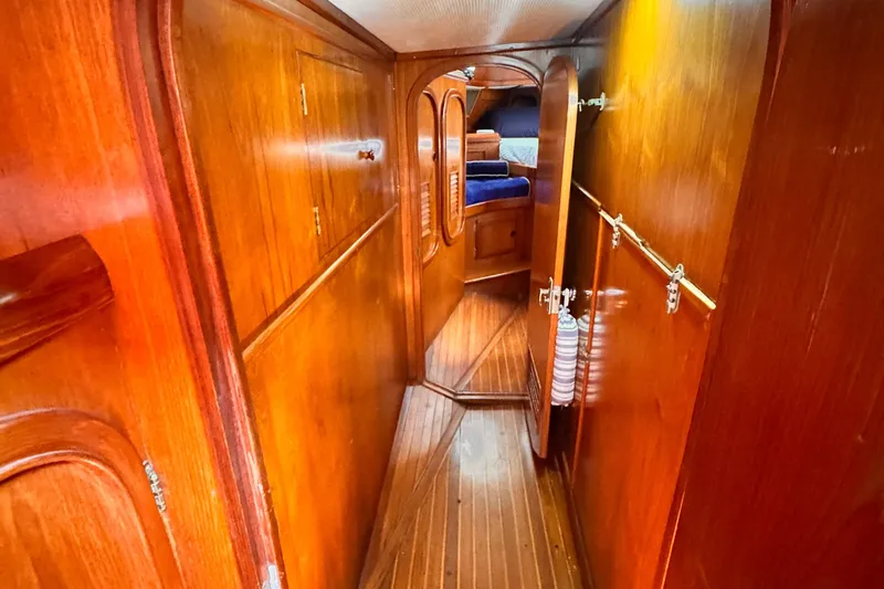 Slide: The Image of Interior of 1982 Kelly Peterson 46 yacht with wooden paneling and cozy cabin. - 22