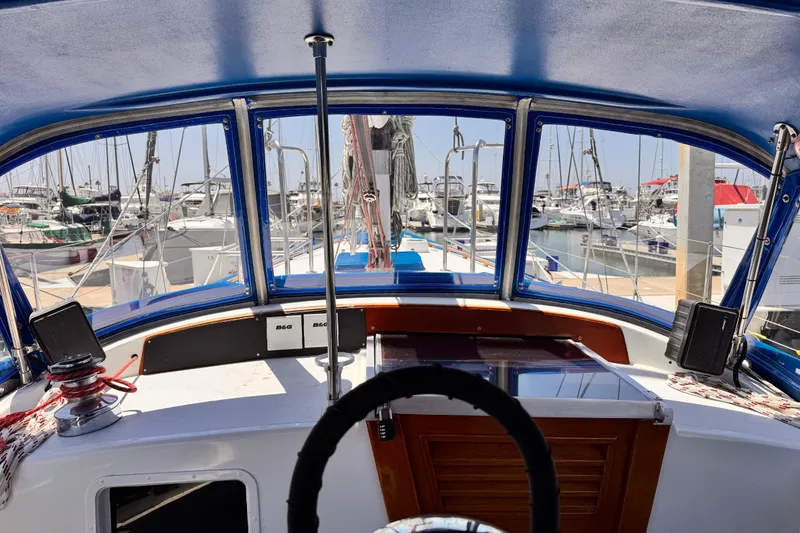 Slide: The Image of Cockpit view of 1982 Kelly Peterson 46 sailboat docked at marina. - 29