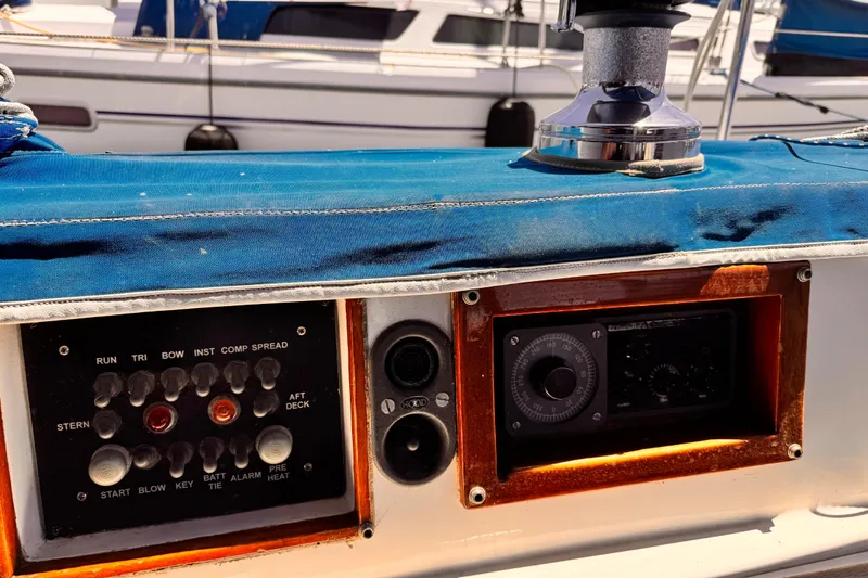 Slide: The Image of Control panel on a 1982 Kelly Peterson 46 sailboat with blue cover and winch. - 32