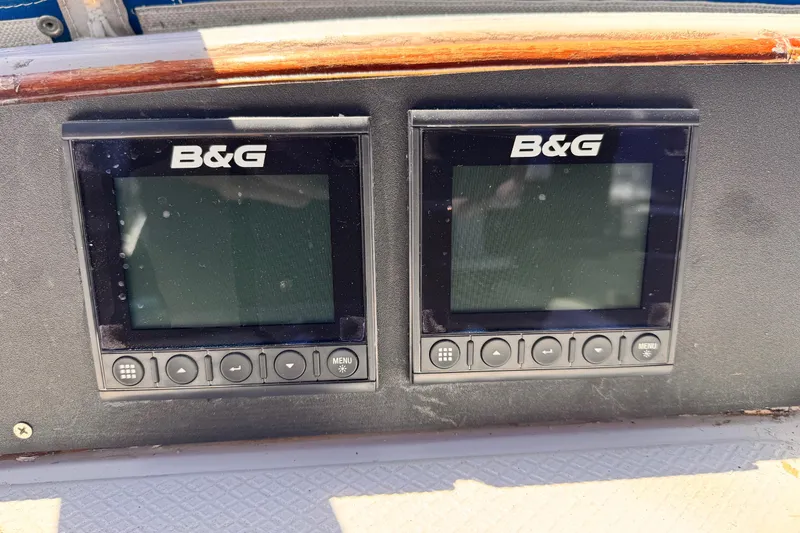 Slide: The Image of B&G navigation displays on a 1982 Kelly Peterson 46 sailboat dashboard. - 33