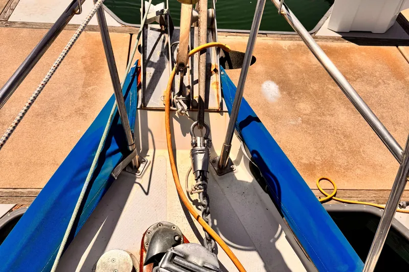 Slide: The Image of Deck view of 1982 Kelly Peterson 46 sailboat with ropes and anchor equipment. - 46