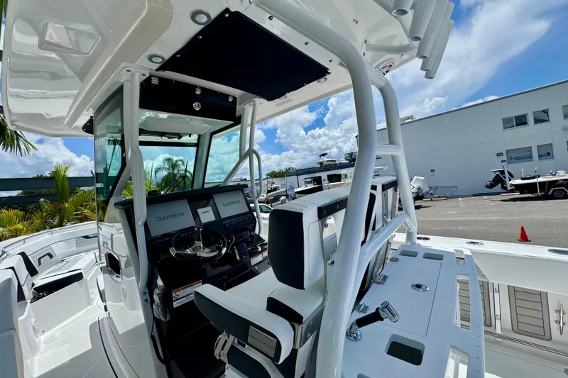 Slide: The Image of 2026 Blackfin 272 CC boat interior with Garmin navigation, sleek design, and modern controls. - 12