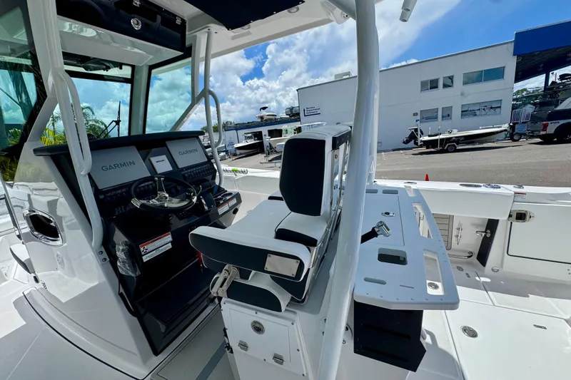 Slide: The Image of 2026 Blackfin 272 CC boat interior with Garmin navigation, sleek design, and modern controls. - 13