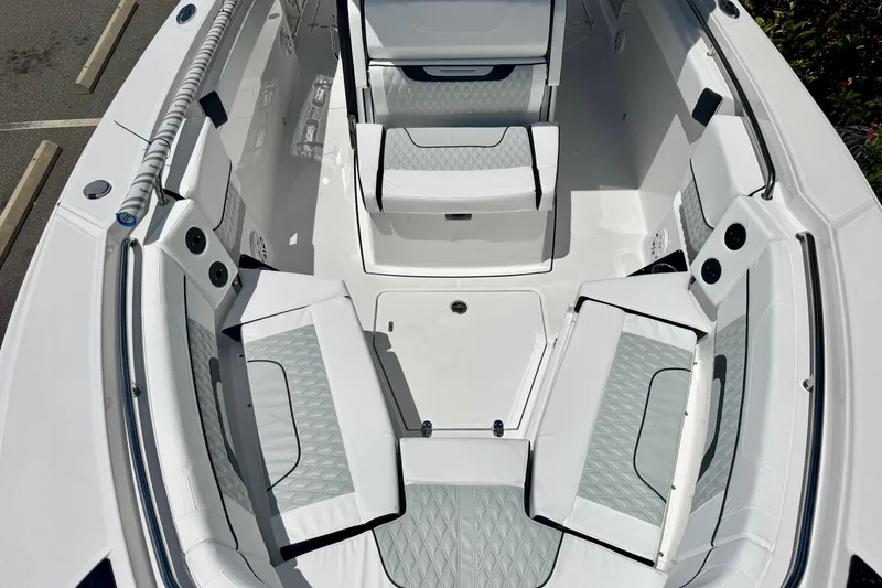 Slide: The Image of 2026 Blackfin 272 CC boat interior with white cushioned seating and modern design. - 22