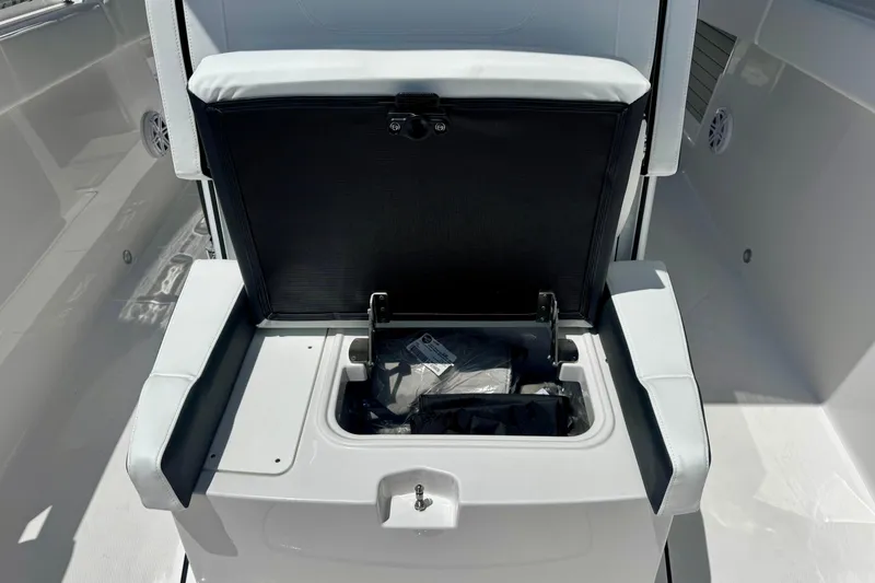 Slide: The Image of 2026 Blackfin 272 CC boat seat with open storage compartment. - 24