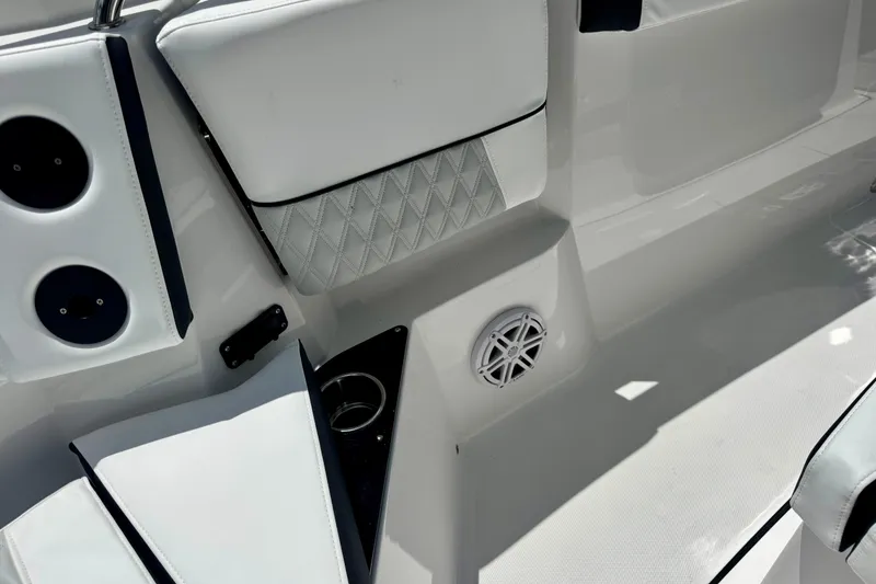Slide: The Image of Interior of 2026 Blackfin 272 CC boat with white seating and speaker. - 25