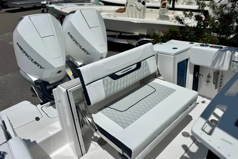 Slide: The Image of 2026 Blackfin 272 CC boat with dual Mercury engines and luxurious seating. - 33