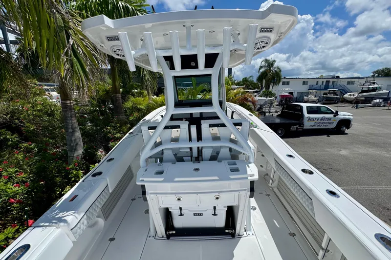 Slide: The Image of 2026 Blackfin 272 CC boat with T-top and center console in marina setting. - 7