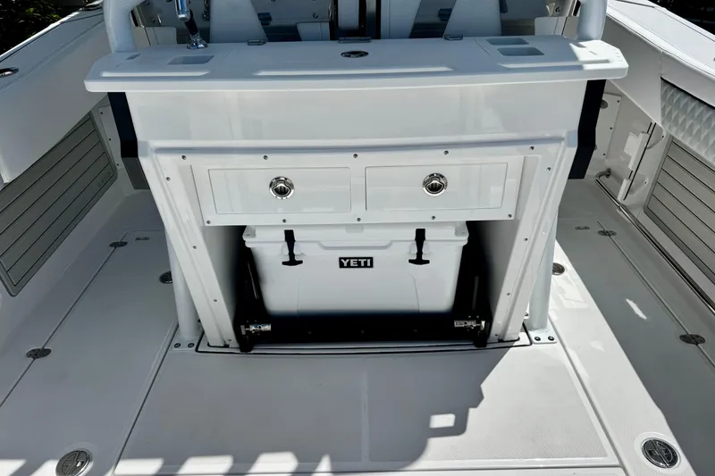 Slide: The Image of 2026 Blackfin 272 CC boat interior with Yeti cooler and storage compartment. - 8