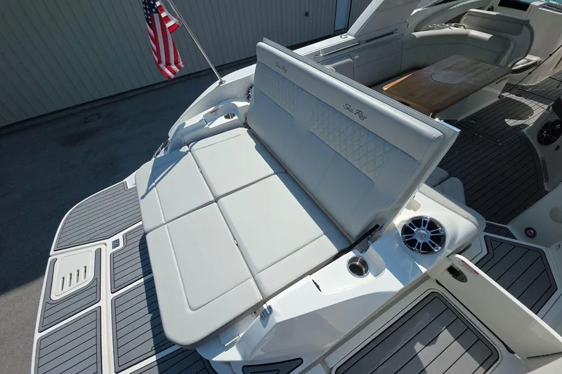 Slide: The Image of 2020 Sea Ray SLX 350 boat with luxurious seating and American flag. - 14