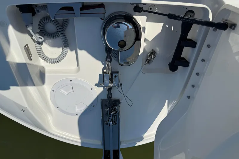 Slide: The Image of 2020 Sea Ray SLX 350 boat anchor system with coiled cable and speaker. - 25
