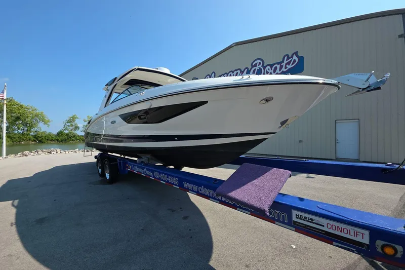 Slide: The Image of 2020 Sea Ray SLX 350 boat on trailer outside showroom. - 3