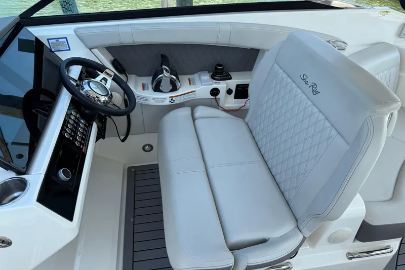 Slide: The Image of 2020 Sea Ray SLX 350 helm with luxurious seating and modern controls. - 30