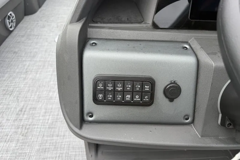 Slide: The Image of Control panel of 2026 Sun Tracker Party Barge 22 DLX with labeled buttons. - 20