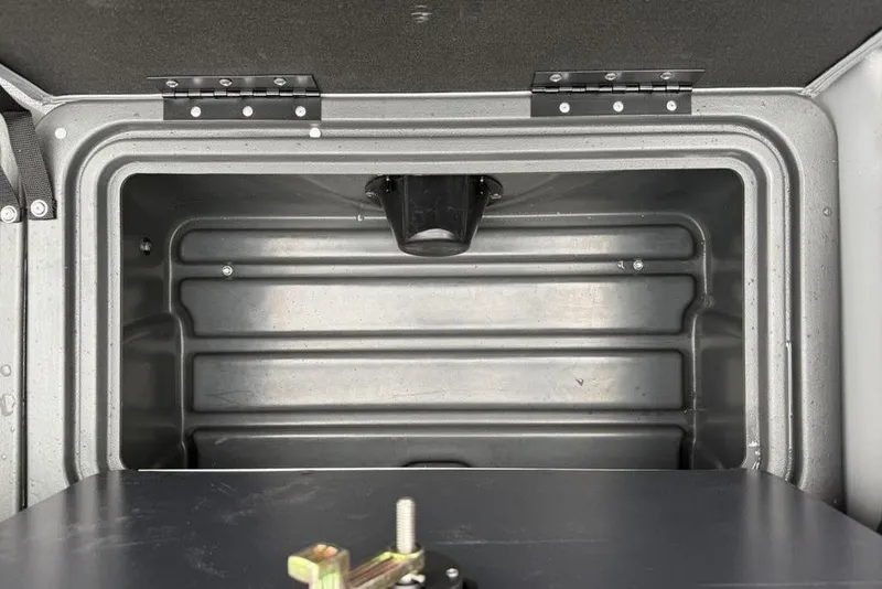 Slide: The Image of Storage compartment of 2026 Sun Tracker Party Barge 22 DLX, featuring durable metal construction. - 26