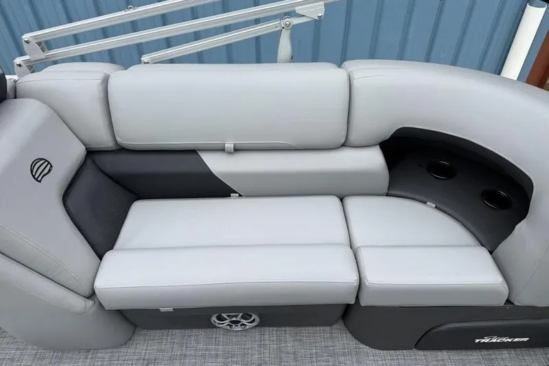 Slide: The Image of 2026 Sun Tracker Party Barge 22 DLX pontoon boat seating with cup holders and sleek design. - 28