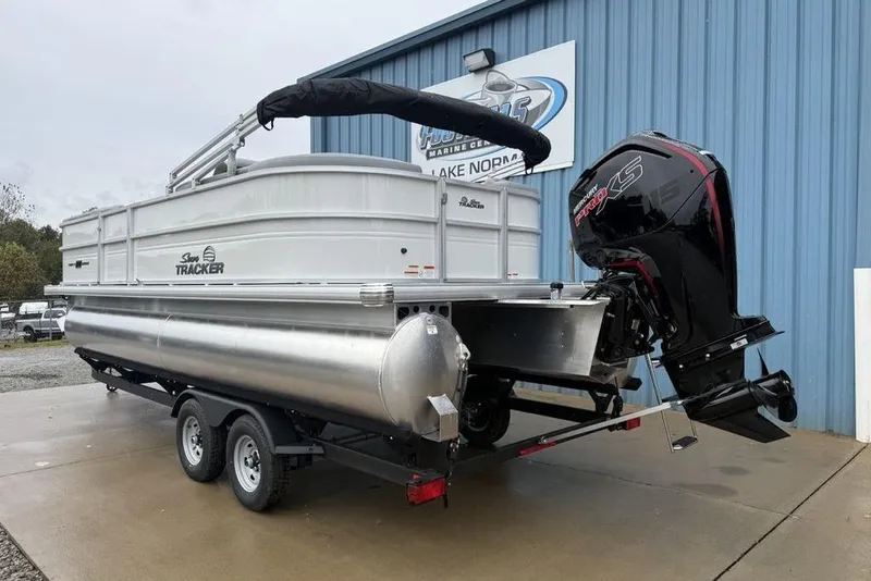 Slide: The Image of 2026 Sun Tracker Party Barge 22 DLX pontoon boat with powerful outboard motor. - 4