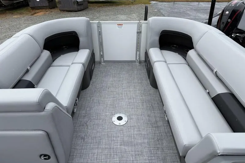 Slide: The Image of 2026 Sun Tracker Party Barge 22 DLX interior with gray seating and spacious layout. - 7