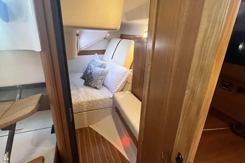 Slide: The Image of Cozy cabin interior of 2026 Catalina 386 sailboat with wooden finish and plush bedding. - 20
