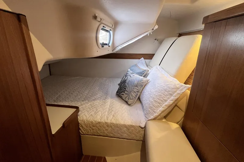Slide: The Image of Cozy cabin interior of 2026 Catalina 386 yacht with comfortable bedding and wooden accents. - 22