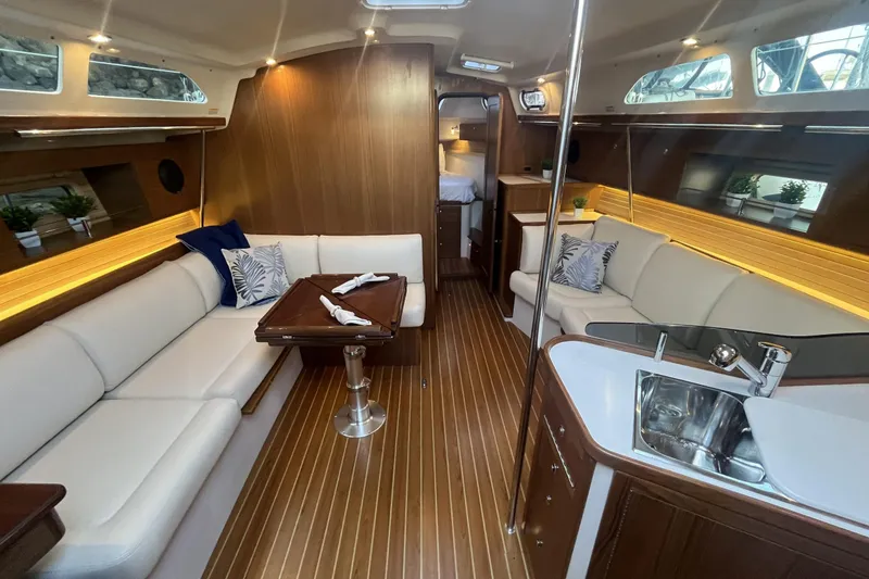 Slide: The Image of Luxurious Catalina 386 yacht interior, featuring elegant wood finishes and modern amenities, 2026 model. - 4